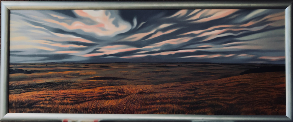 Endless otherworldly landscape of eerie light of gently undulating windswept grassland