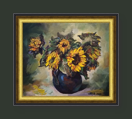 A vase of sunflowers are on a light green background. 