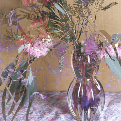 Floral bouquet with vintage glass vase.