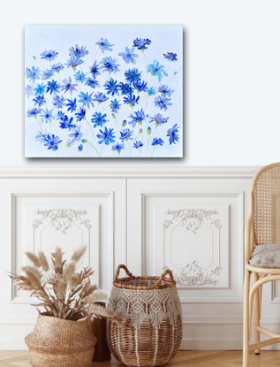 A thickly textured  blue floral painting of cornflowers on a pale grey background.