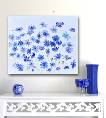 A thickly textured  blue floral painting of cornflowers on a pale grey background.