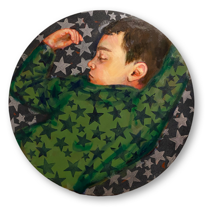 A portrait of a boy sleeping wearing green star pajamas.