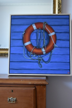 An orange buoy with drooping ropes hangs against a blue weatherboard wall  

This work will be on display at Bluethumb's Melbourne Gallery for the exhibition 'Rising Realism' from April 12th.