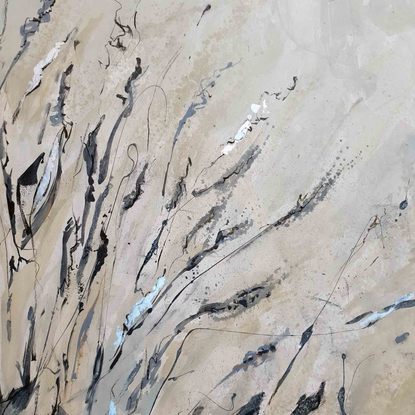 An abstract of wild grass and leaves in light grey, beige and white with silver leaf.  