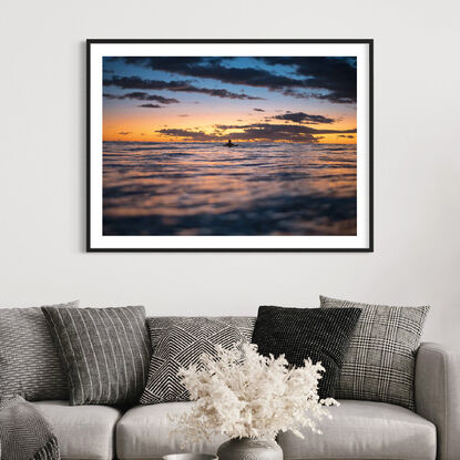 Surfer silhouette at sunrise