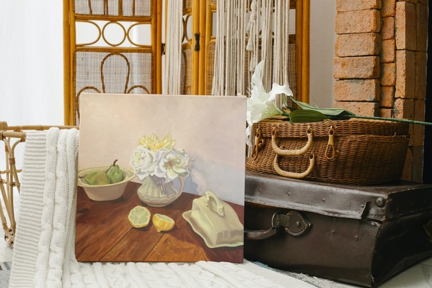 Butter dish, jug with yellow and white roses, bowl with pears, and cut lemon halves