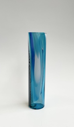 Tall cylinder vase with a mix of blue and white transparent and opaque colours