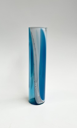 Tall cylinder vase with a mix of blue and white transparent and opaque colours