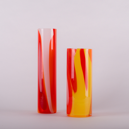 Tall cylinder vase in a mixture of reds, oranges and whites