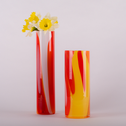 Tall cylinder vase in a mixture of reds, oranges and whites