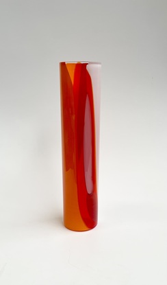 Tall cylinder vase in a mixture of reds, oranges and whites