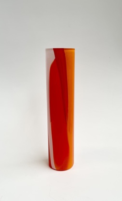 Tall cylinder vase in a mixture of reds, oranges and whites