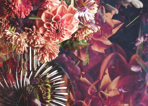 Floral bouquet with vintage glass vase.