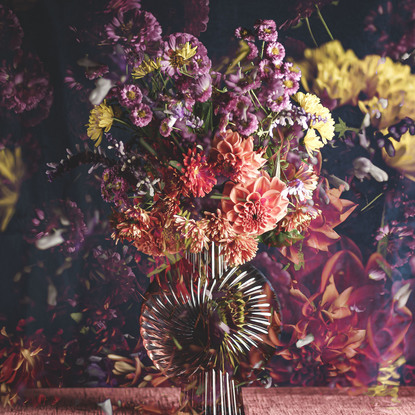 Floral bouquet with vintage glass vase.