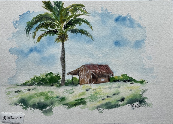 A straw hut under the shade of a coconut tree over a small hilltop