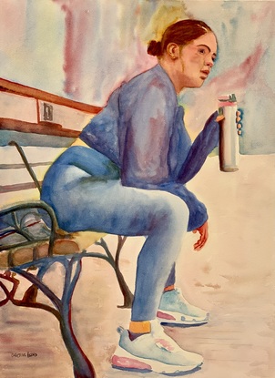 A female jogger takes a break on a bench.