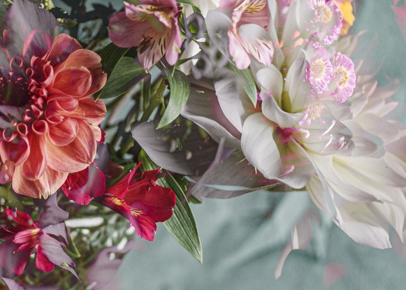 Floral bouquet with vintage glass vase.