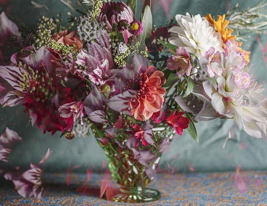 Floral bouquet with vintage glass vase.