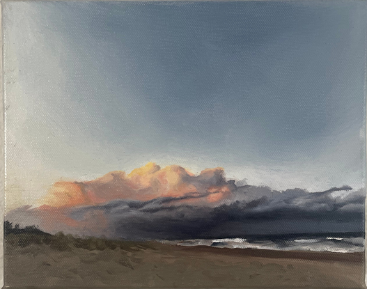 Small oil painting of the beach, with brooding clouds in the distance. 