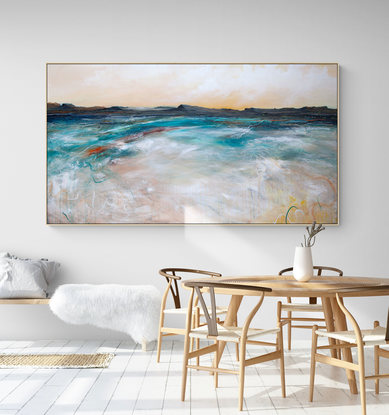 Abstract seascape in spring tones of yellow, blue  and teal with mountain range in the horizon under a dramatic cloudy sky.