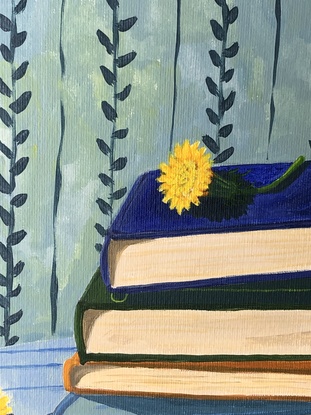 Pile of books on a striped blue tablecloth, with dandelions and vine wallpaper behind. 