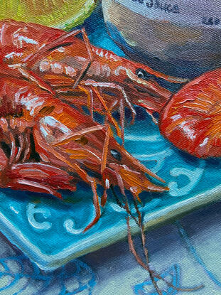 Prawns on a blue plate with lemon and a jar of cocktail sauce and textured background painted from life