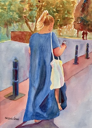 Woman walks in the street.