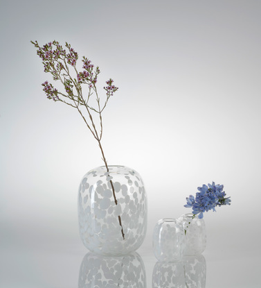 Large, rounded clear glass vase with opaque white spots