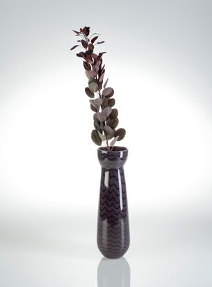 Set of five vases, five different colours, tall with black wiggly lines wrapping around in a spiral.