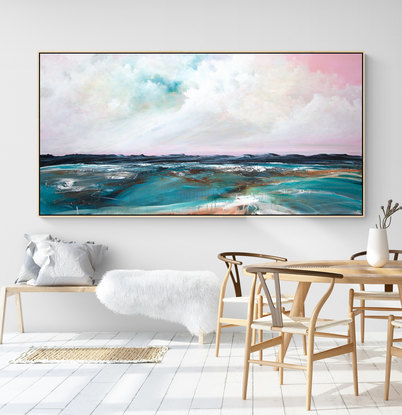 Abstract seascape in grey blue  and teal with mountain range in the horizon under a dramatic pink cloudy sky.