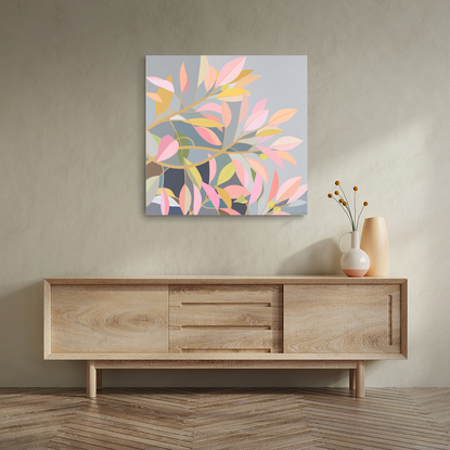 Colourful Moreton Bay Fig leaves in hues of pale pinks and golds on a background of light grey and darker blues