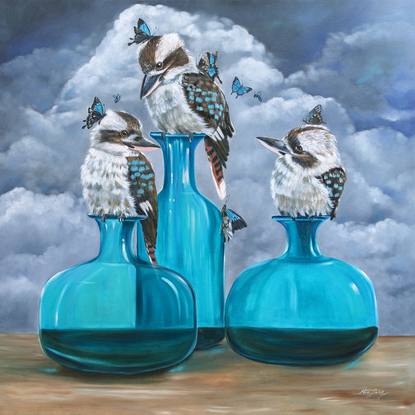 Three kookaburras sitting on glass vases against a stormy background. 