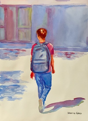 Boy walking with a blue back pack.