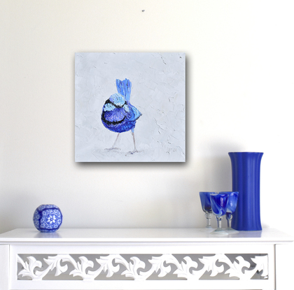 A thickly textured painting of a blue male Splendid Fairy Wren on a soft grey background.