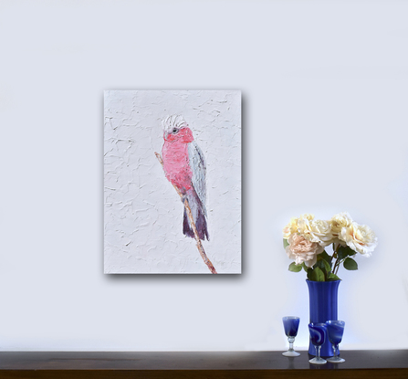 A thickly textured painting of a pink and grey Galah Cockatoo on a perch.