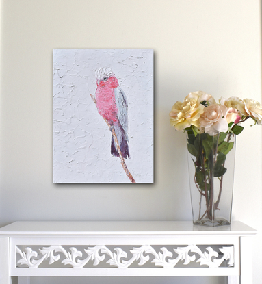 A thickly textured painting of a pink and grey Galah Cockatoo on a perch.