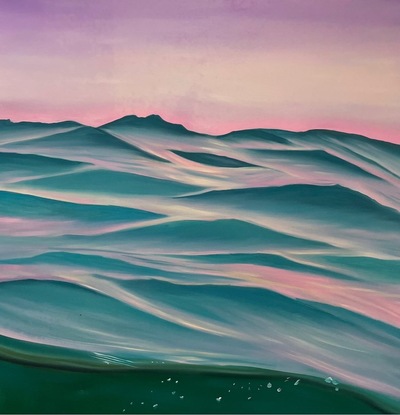 Purple sky over light turquoise ripples and a view of underwater