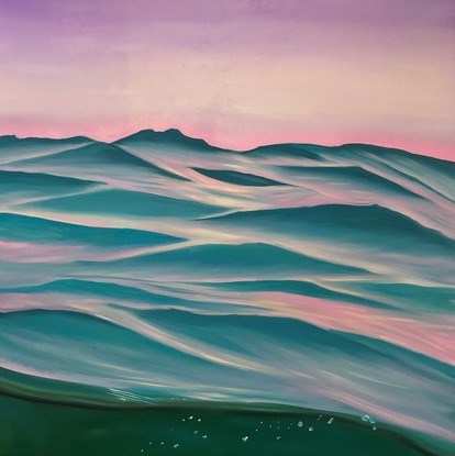 Purple sky over light turquoise ripples and a view of underwater