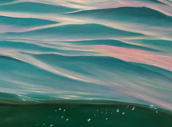 Purple sky over light turquoise ripples and a view of underwater