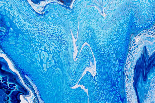 ABSTRACT painting that gives the impression of soothing ocean waves lapping an outer reef.  The intricate mosaic pattern within the tonal blue hues and the glimmering adds added interest and intrigue the close one gets to the painting. The painting actual feels as though it is moving.