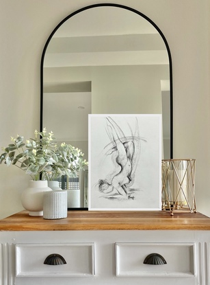 Nude female drawing in pencil and charcoal depicted in handstand yoga pose. Free flowing with movement in line form. 