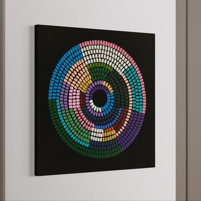 Circular shape made up of vibrant colours on black background 