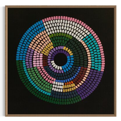 Circular shape made up of vibrant colours on black background 