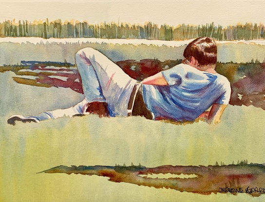 Man lying down on grass.