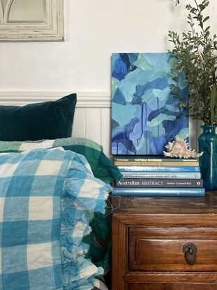 Varying shades of deep blues and pale greens expressively pieced together with drips and spatters