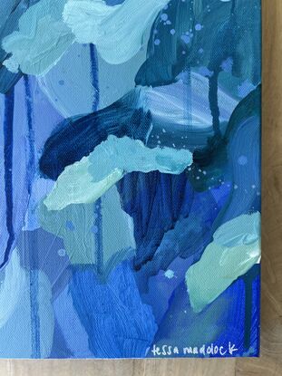 Varying shades of deep blues and pale greens expressively pieced together with drips and spatters