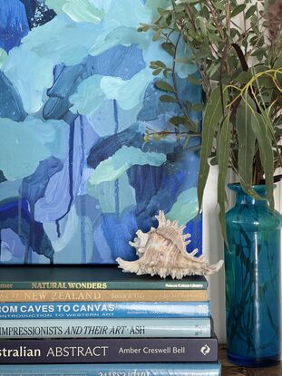 Varying shades of deep blues and pale greens expressively pieced together with drips and spatters