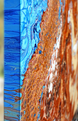 ABSTRACT painting that gives the impression of soothing ocean waves lapping in to soft sandy shore.  The intricate mosaic pattern within the tonal blue hues and the glimmering adds more and moe magical interest and intrigue the closer one gets to the painting. Metallics add an extra depth because the painting changes personality when one views from different angles.