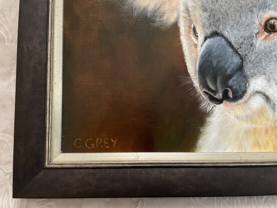 Oil painting of a koala, with a reflection of a firefighter in his eye