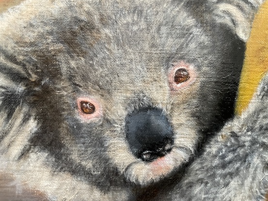 Oil painting of a firefighter, holding a koala with bushfires in the background